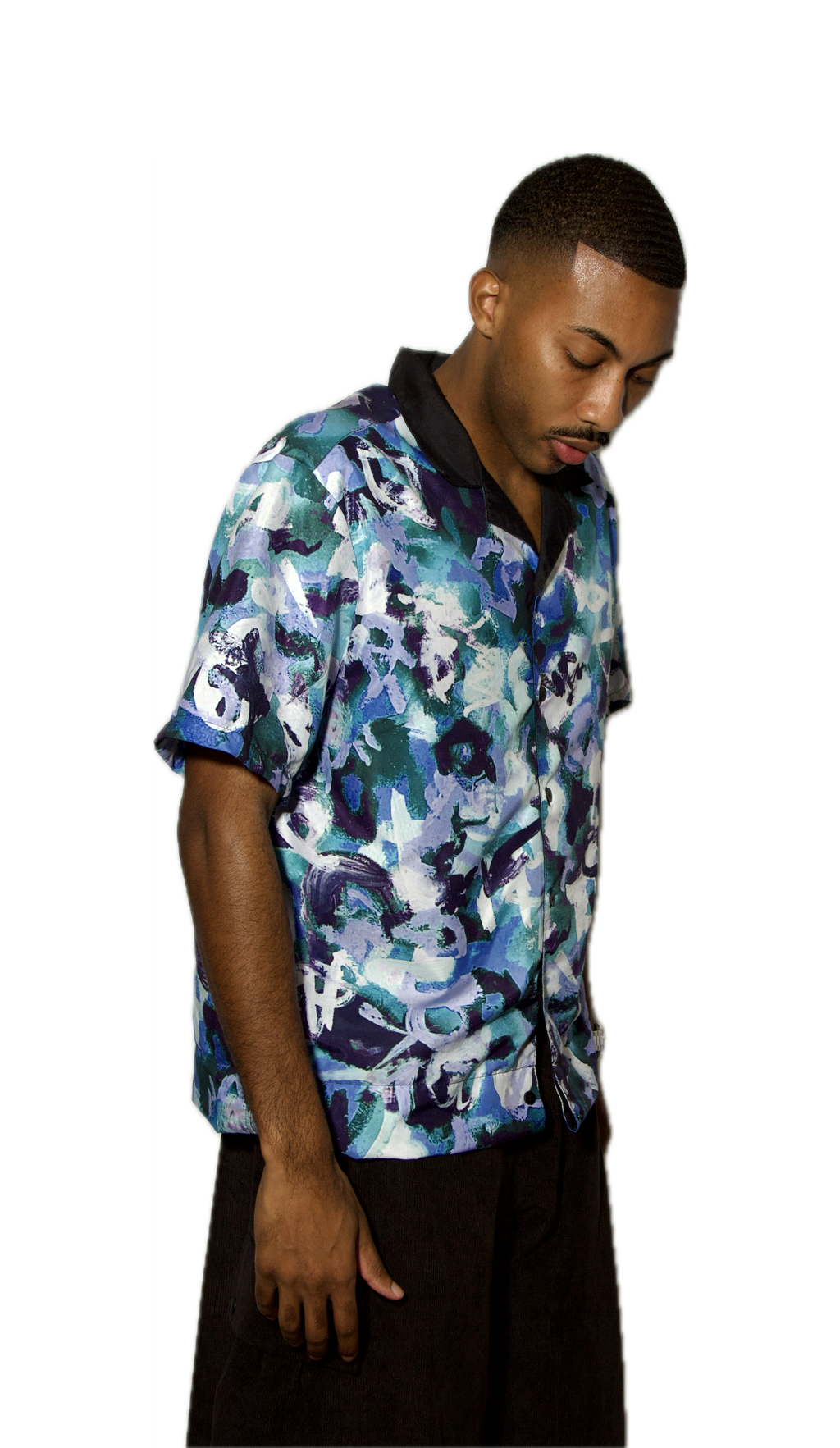 Man wearing a colorful floral shirt on a white background